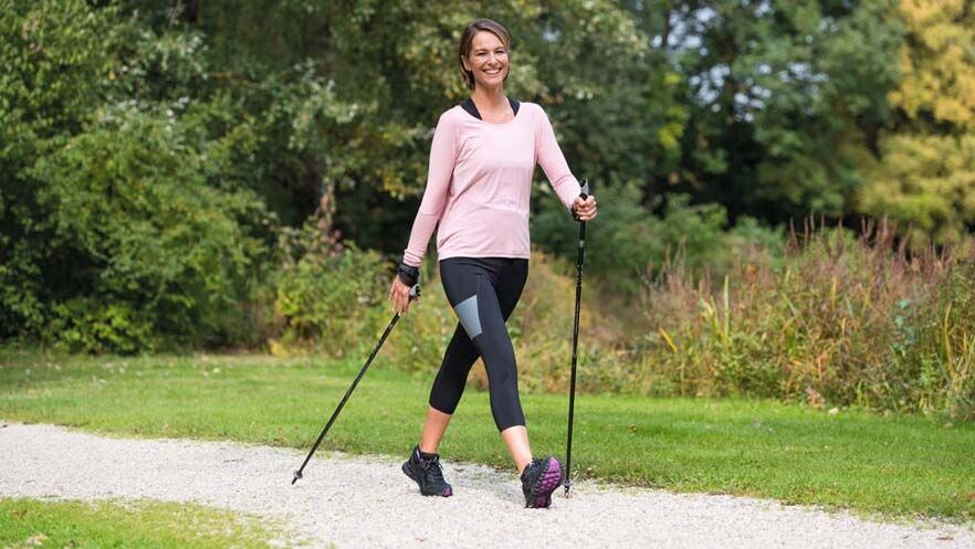 a woman is busy walking to avoid back pain