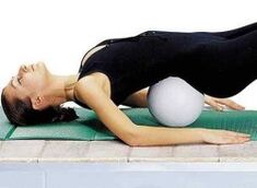 Exercise with a roll under the lower back